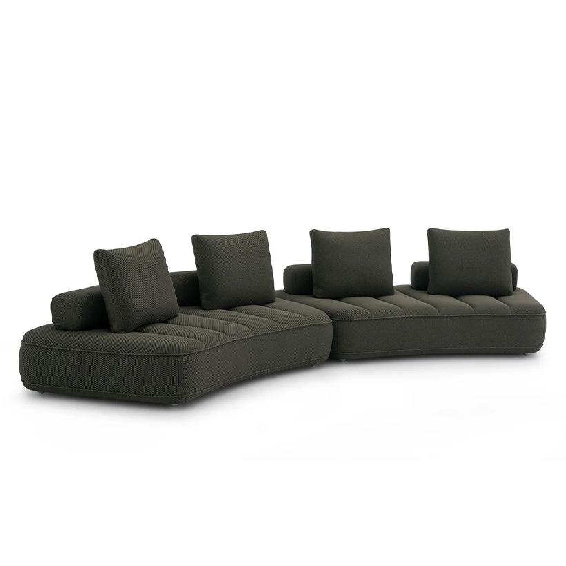 Contemporary modular sofa in anthracite, featuring three curved sections with quilted seats and several matching rectangular cushions.