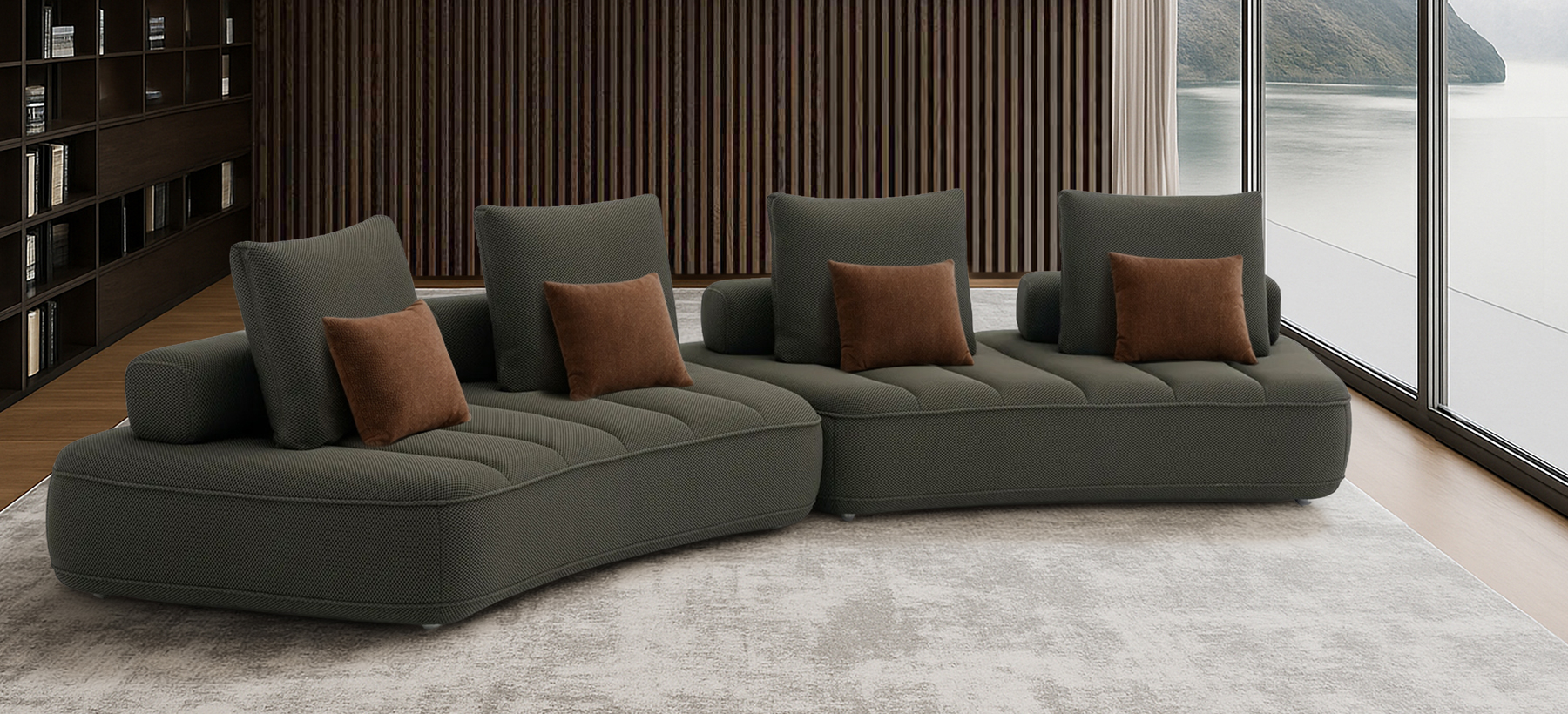 Canapé modulaire contemporain de couleur anthracite, composé de trois modules courbés avec assises matelassées et plusieurs coussins rectangulaires assortis.