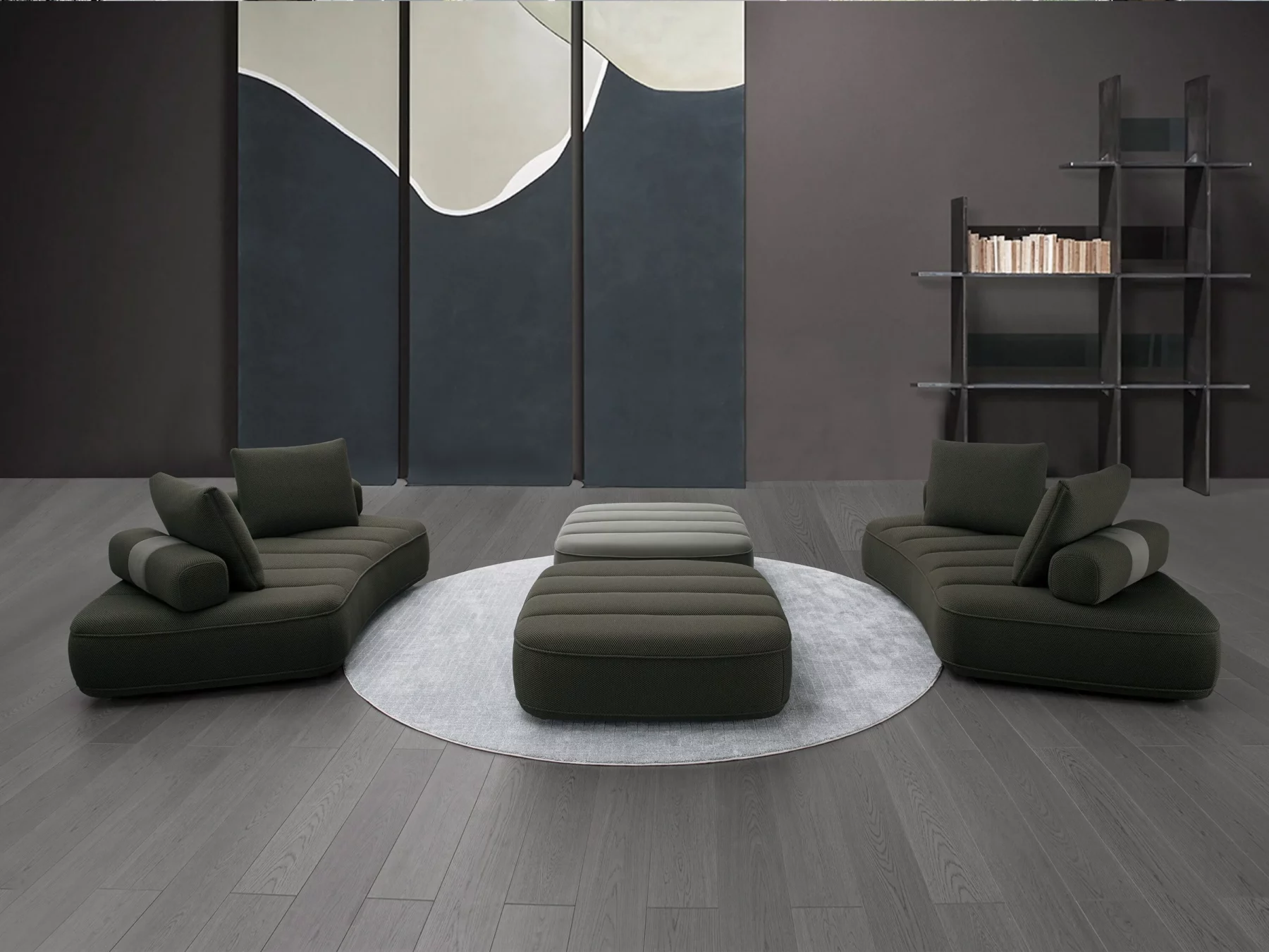 Canapé modulaire contemporain de couleur anthracite, composé de trois modules courbés avec assises matelassées et plusieurs coussins rectangulaires assortis.