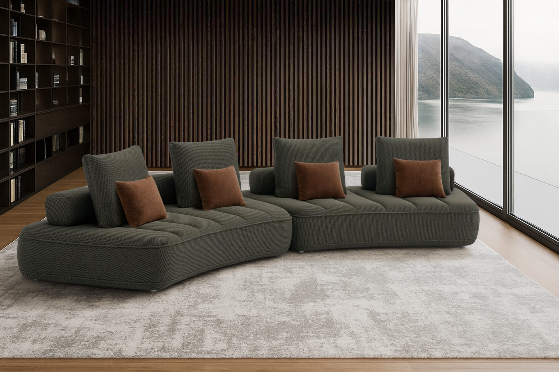 Contemporary modular sofa in anthracite, featuring three curved sections with quilted seats and several matching rectangular cushions.