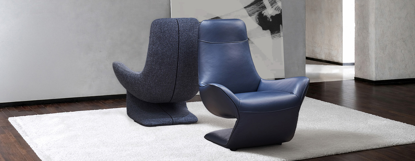 VOCALE armchair in blue leather and grey fabric, sculptural Z-shaped design by Joly Design for Kler (2018), displayed in a contemporary interior.