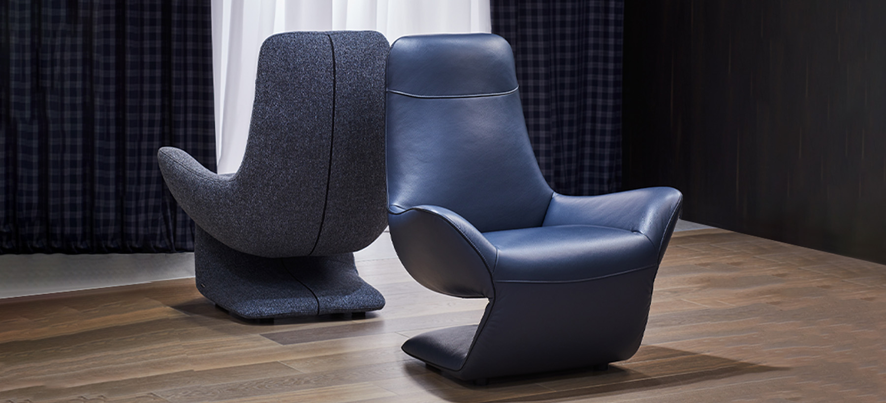 VOCALE armchair in blue leather and grey fabric, sculptural Z-shaped design by Joly Design for Kler (2018), displayed in a contemporary interior.
