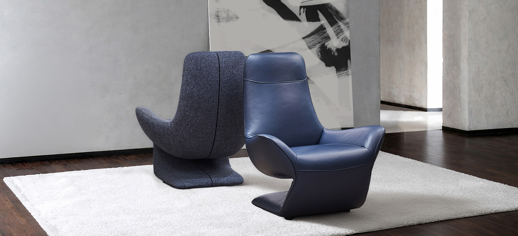 VOCALE armchair in blue leather and grey fabric, sculptural Z-shaped design by Joly Design for Kler (2018), displayed in a contemporary interior.