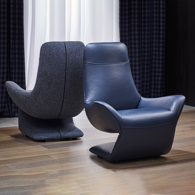 VOCALE armchair in blue leather and grey fabric, sculptural Z-shaped design by Joly Design for Kler (2018), displayed in a contemporary interior.